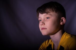 Child with autism looking thoughtfully ahead